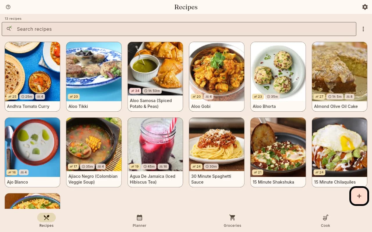The shiso recipe library on desktop: a warm cream interface with a search field across the top and a grid of recipe cards, each a photo above its title with small badges for calories, total time and servings. A bottom bar switches between Recipes, Planner, Groceries and Cook.